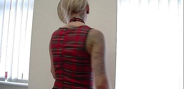  Blonde tattooed chick in a miniskirt teasing